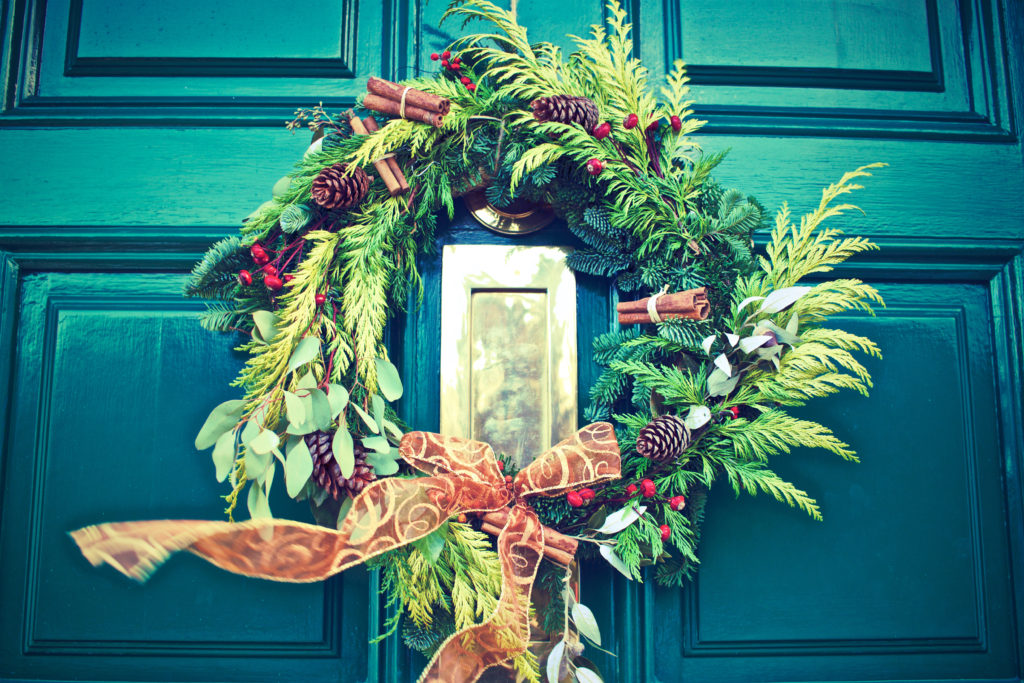 Green door with wreath